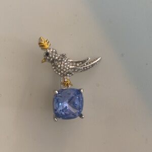 Elegant Silver Bird pin with Blue Stone. Dress up or wear with jeans.